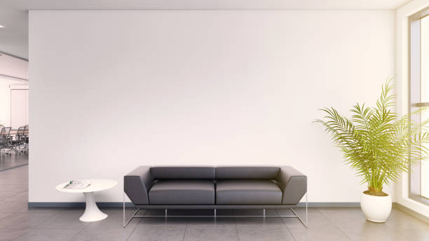 Office interior lobby desk Office interior lobby . Blank wall for copy space, lots of light, sunlight scene. Black leather sofa. gray floor tiles. daylight scene. designer copy space background surrounding wall photos stock pictures, royalty-free photos & images