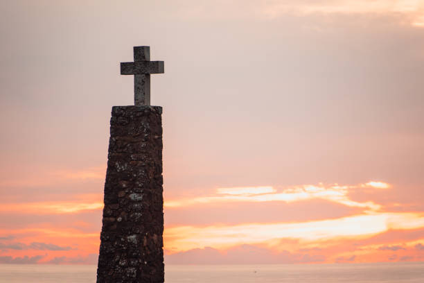 istock Christian cross at sunset 915803428