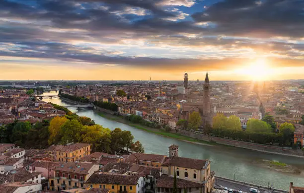 View to the old town of Verona, Italy, during a summer sunset