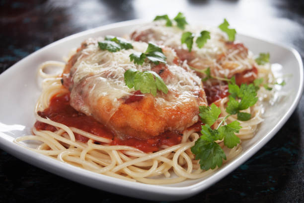 istock Chicken parmesan with spaghetti pasta 915807036
