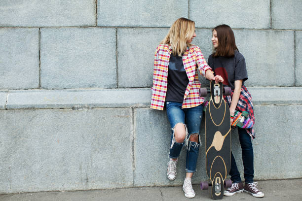 istock mother and daughter walking together 915809822