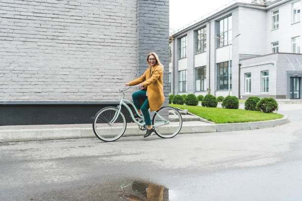 istock stylish woman on bicycle 915814674