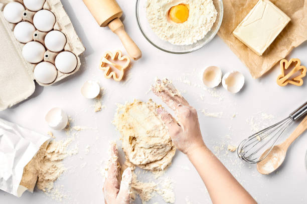 istock Baker preparing to knead the dough, top view. Cooking, bakery concept 915819510