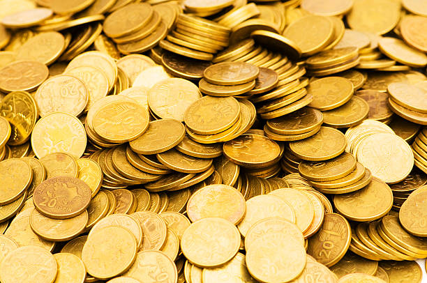 istock Pile of golden  coins isolated on white 91582015