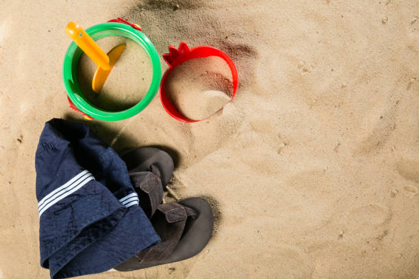 istock Summer concept - sand and toys, shoes 915822140