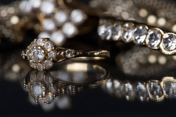 istock Gold jewelry with diamonds on blackboard. 915822828