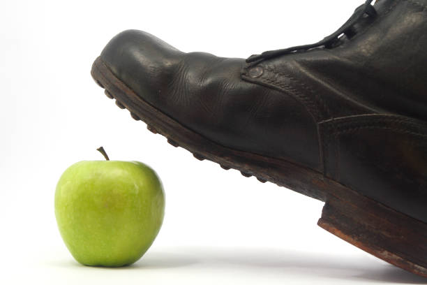 militar de sapatos e maçã verde - apple fruit surreal bizarre imagens e fotografias de stock