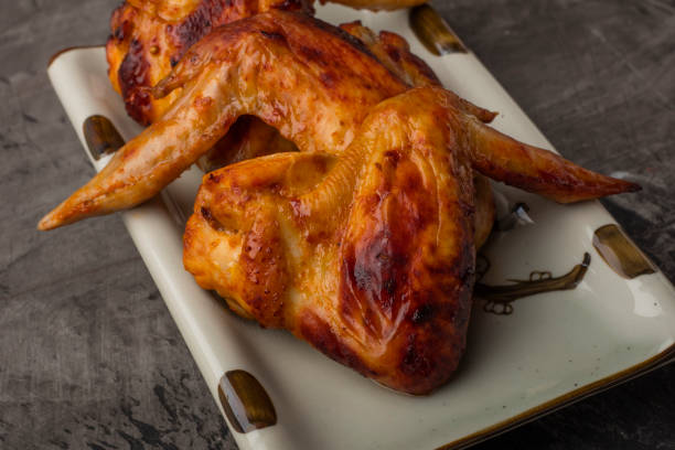 istock A plate of chicken wings on a dark background 915827226