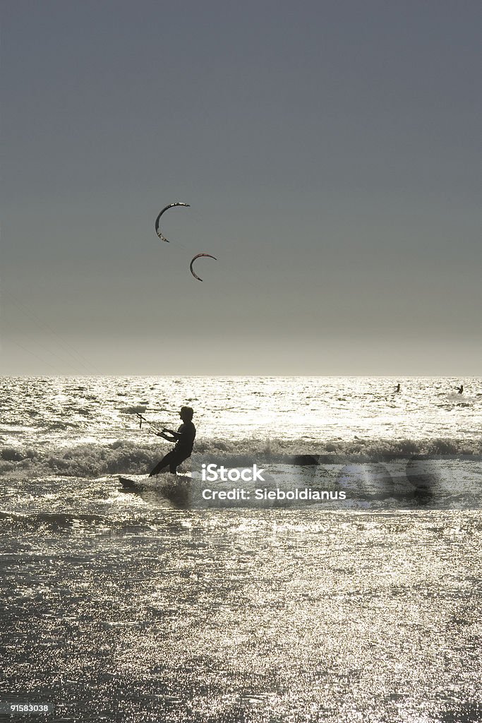 Kite surfers at sunset in California - Waddell Creek Beach.  Adult Stock Photo