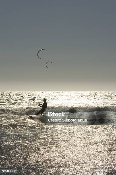 Kite Surfers At Sunset In California Waddell Creek Beach Stock Photo - Download Image Now