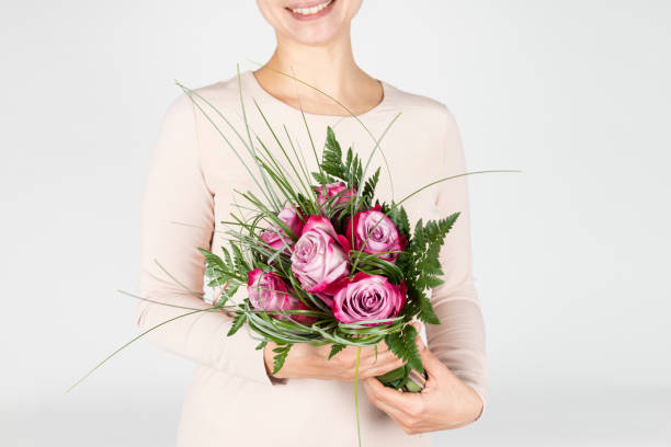 istock Woman Hugging Roses 915834388