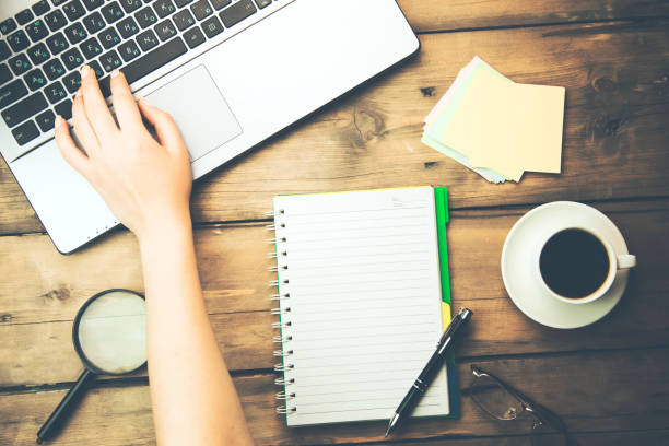 istock woman hand on notebook working in office 915838566