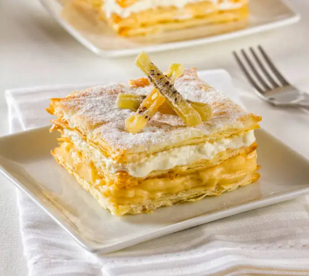 Mille-feuille or Napoleon pastry. A tompoes or tompouce is a pastry in the Netherlands and Belgium. It is the local variety of the mille-feuille.