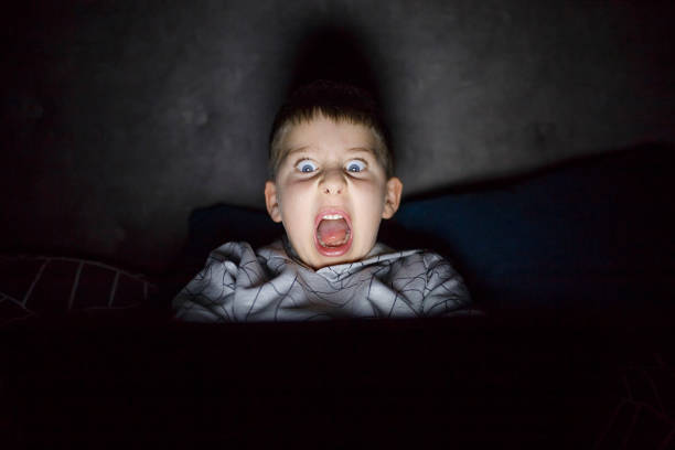 istock Scared and sleepless boy in bedroom 915842870