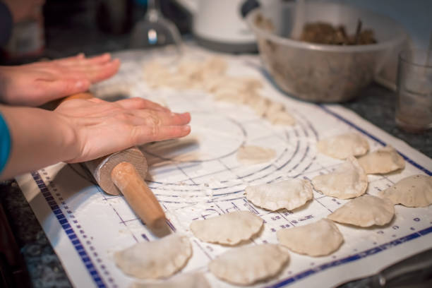 istock Woman preparing pierogi in the kitchen 915843572