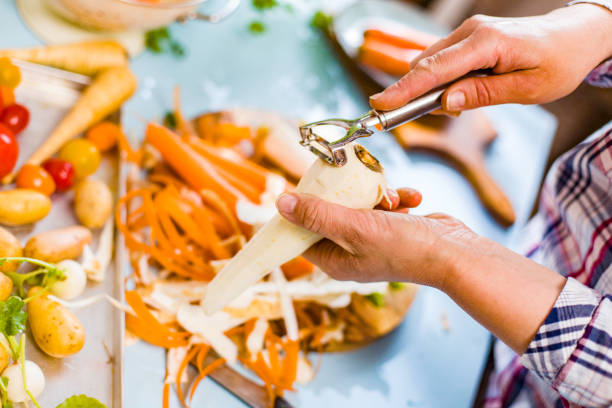 istock Cutting Fresh Parsnips on Wooden Board 915845922