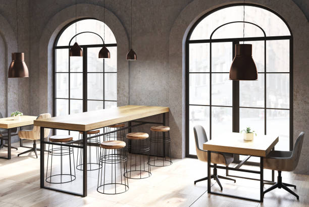 istock Dark concrete cafe corner, wooden tables 915846954