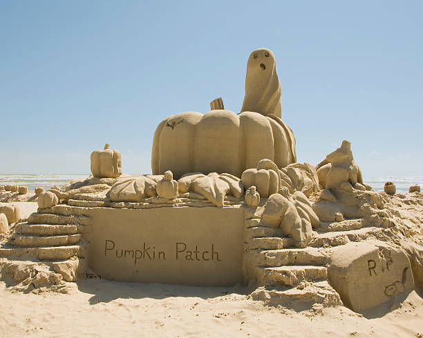 sand sculpture of pumpkin patch stock photo