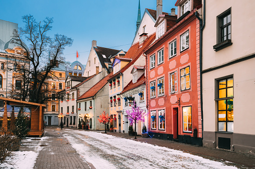 Riga, Latvia. Decorated Facades Of Old Houses On Meistaru Street In Evening. Winter New Year Holiday Season