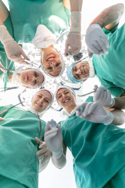Team of nurses and surgeons in surgery