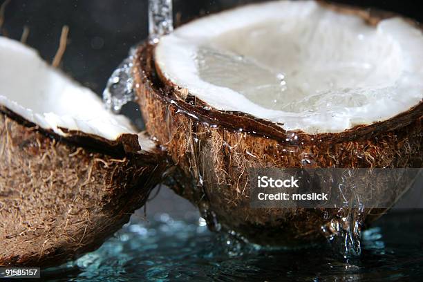 Close Up Of Water Dripping On Split Coconut Stock Photo - Download Image Now - Coconut, Wet, Backgrounds