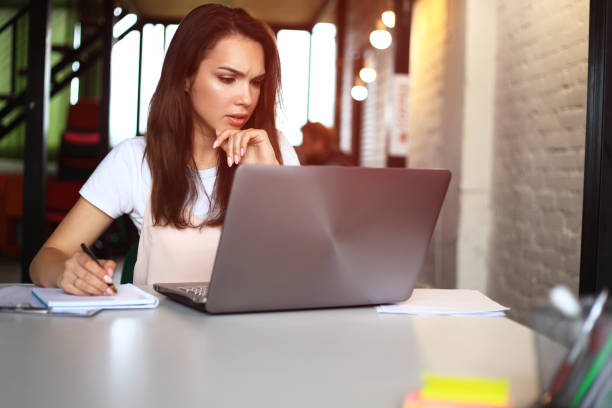 istock Hipster Woman use Laptop huge Loft Studio.Student Researching Process Work.Young Business Team Working Creative Startup modern Office.Analyze market stock,new strategy 915854818