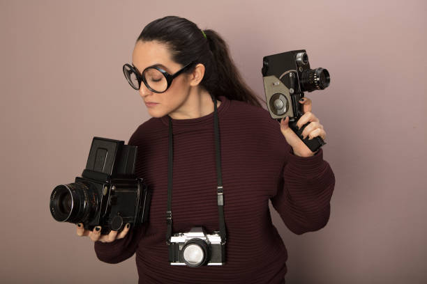 istock Nerdy young camera boffin with over size glasses 915861440