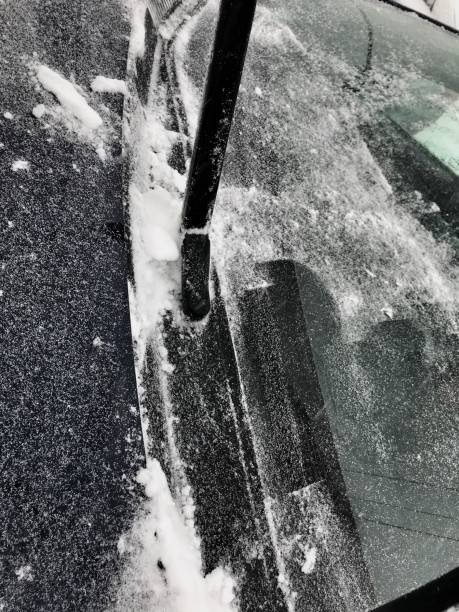 istock On a snowy day, wipers lifted to clean the car windshield thoroughly. 915862054