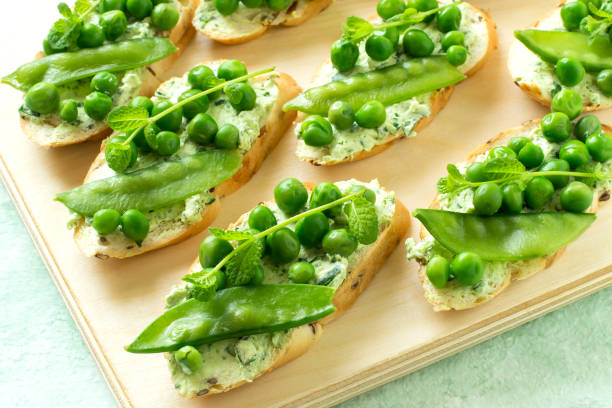 istock Fresh spring toast with cottage cheese and herbs, green peas and mint sprouts 915865314