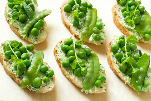 istock Fresh spring toast with cottage cheese and herbs, green peas and mint sprouts 915865322