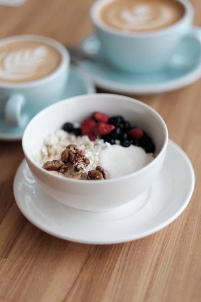 istock Breakfast. Cottage cheese with fresh berries and nuts, and coffee 915868286