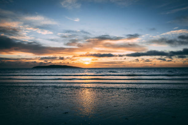 istock Bright sunrise on beach in Rush Ireland 915868332