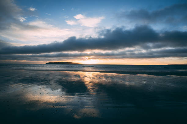 istock Bright sunrise on beach in Rush Ireland 915871394