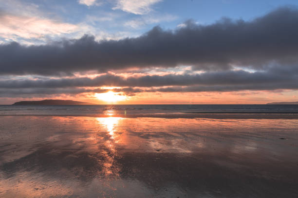 istock Orange beach sunrise in Rush Ireland 915873908