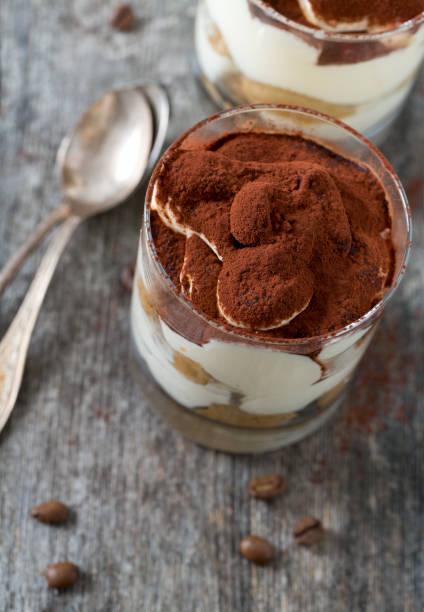 istock tiramisu in glass on wooden surface 915874902