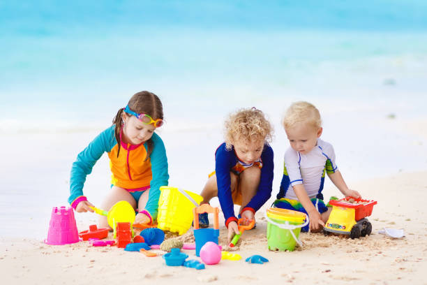 istock Kids on tropical beach. Children playing at sea. 915875454