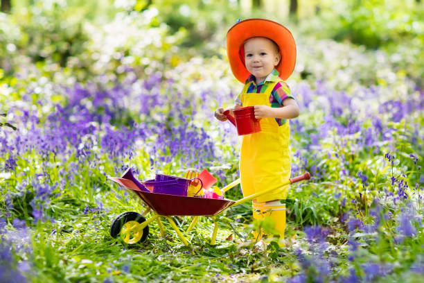istock Kids in bluebell garden 915881804