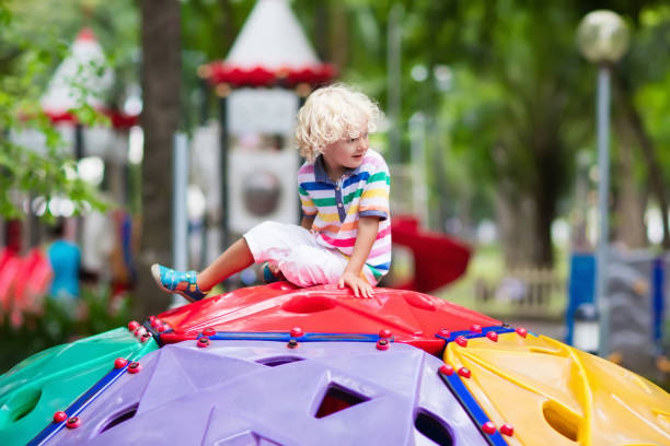 istock Child on school playground. Kids play. 915883382