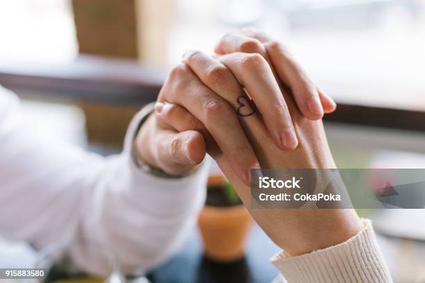Couple Holding Hands Stock Photo - Download Image Now - Tattoo, Couple - Relationship, Finger