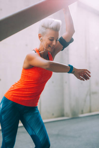 istock Sportswoman using a smart watch 915886218