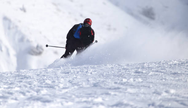istock people skiing in the winter 915886240
