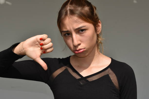 istock Teenager With Thumbs Down 915889060