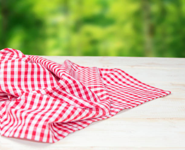 istock The checkered tablecloth on wooden table. 915889362
