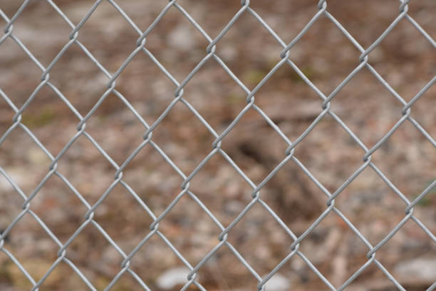 istock Chain Link Fence with Urban Background 915897140