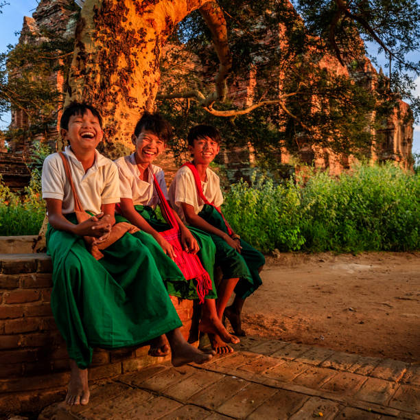 istock Young Burmese schoolboys resting in Bagan, Myanmar 915897442