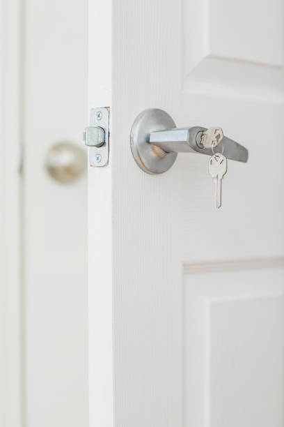 istock door with key in lock 915900556