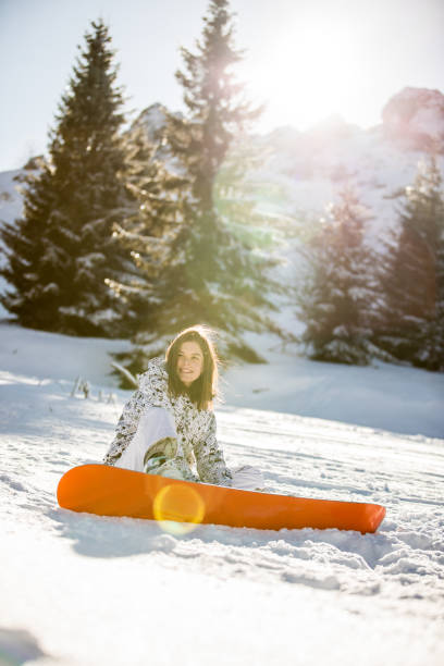 istock Snowboarder Girl Taking A Break 915904324