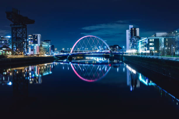 Night view of the Clyde Arc Night view of the Clyde Arc or Squinty Bridge from the East and river Clyde, Glasgow, Scotland glasgow scotland stock pictures, royalty-free photos & images