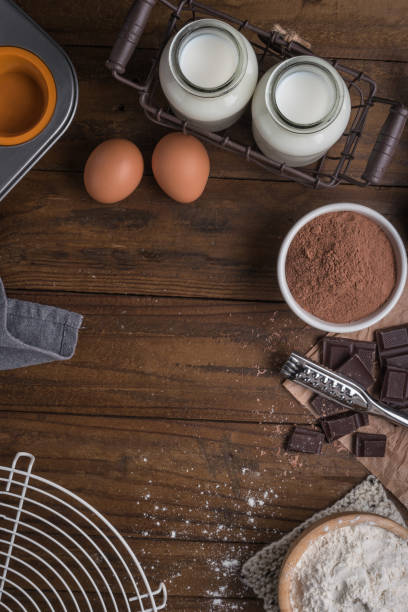 istock Ingredients to cooking muffins in a rustic setting on wooden table with copyspace. 915908288