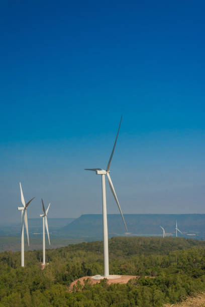 istock wind turbine generating electricity with blue sky . 915911260